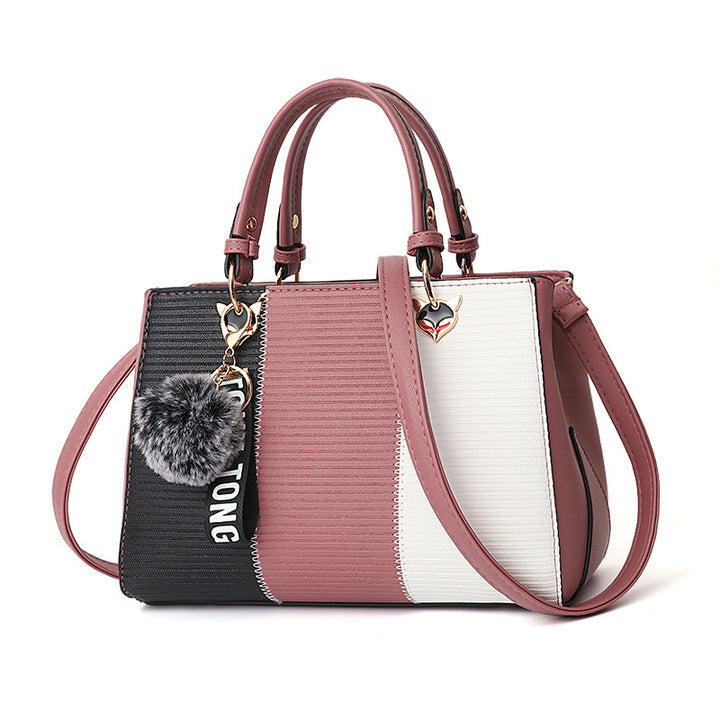 Colorblock handbag with pom-pom charm