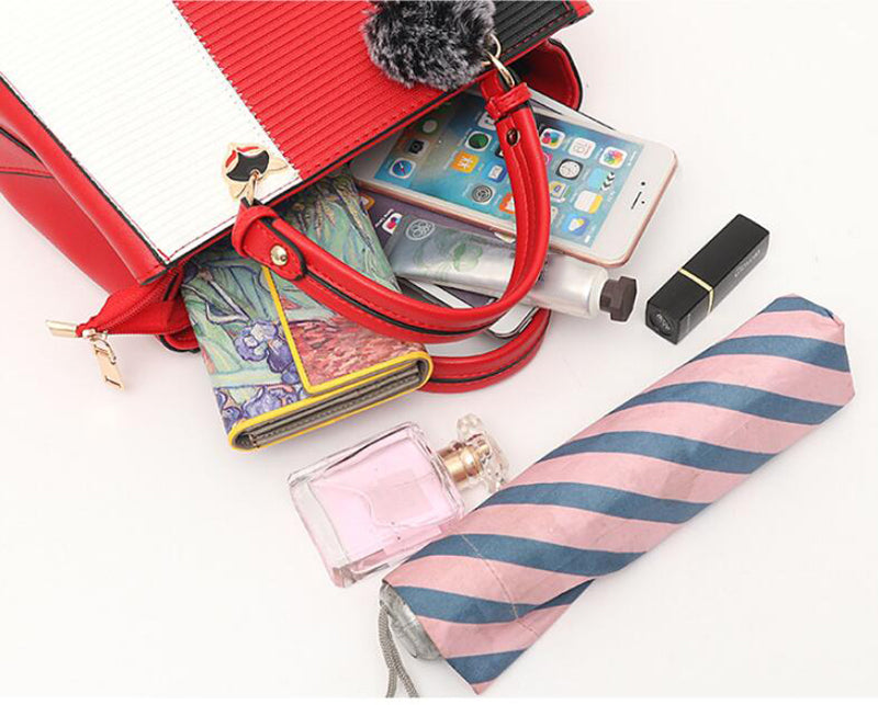Colorblock handbag with pom-pom charm