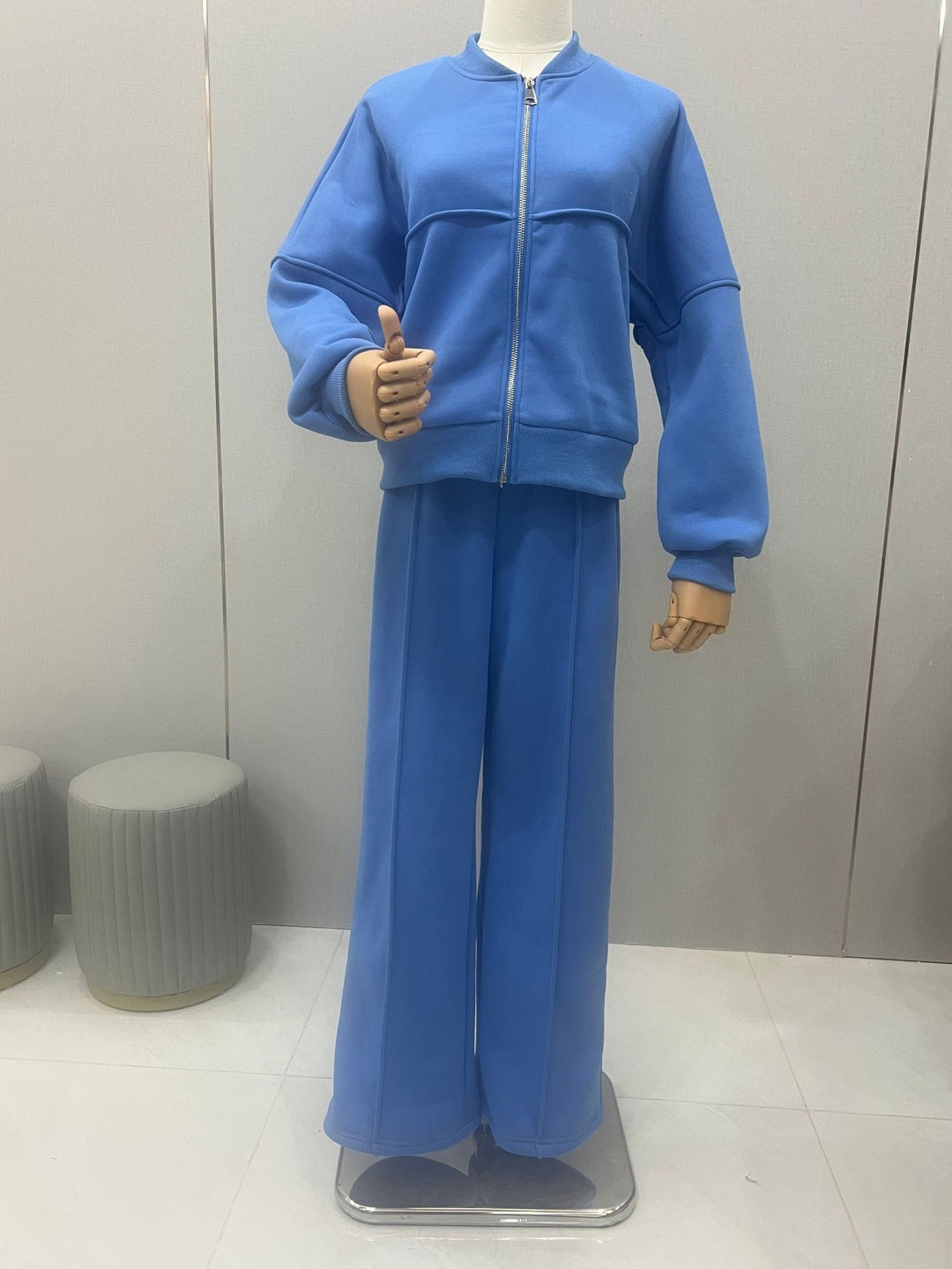 Woman in a zip jacket and wide-leg pants set