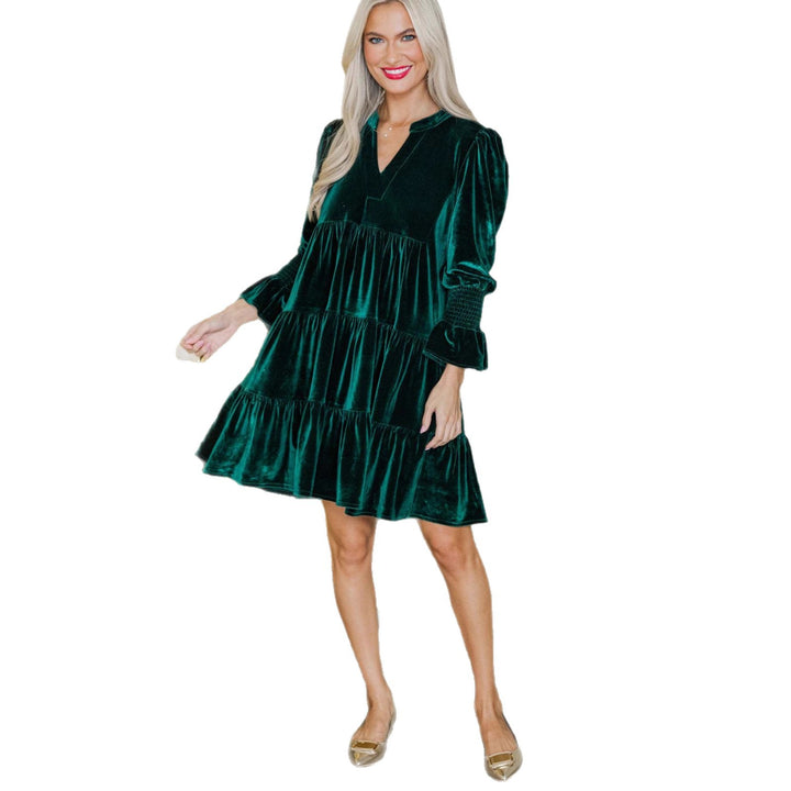 Woman in a green velvet mini dress
