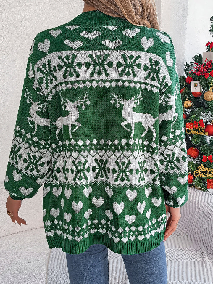 Woman in a reindeer knit cardigan