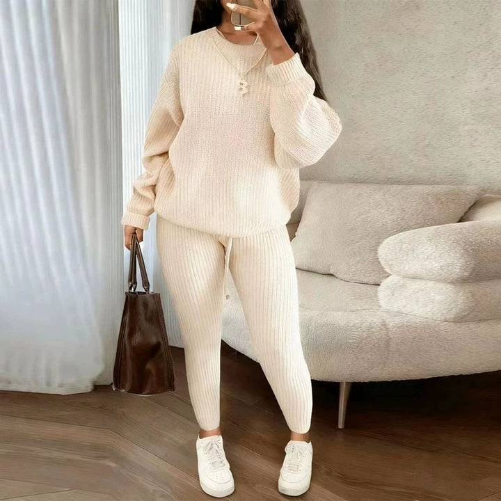 Woman in matching ribbed knit sweater and pants set